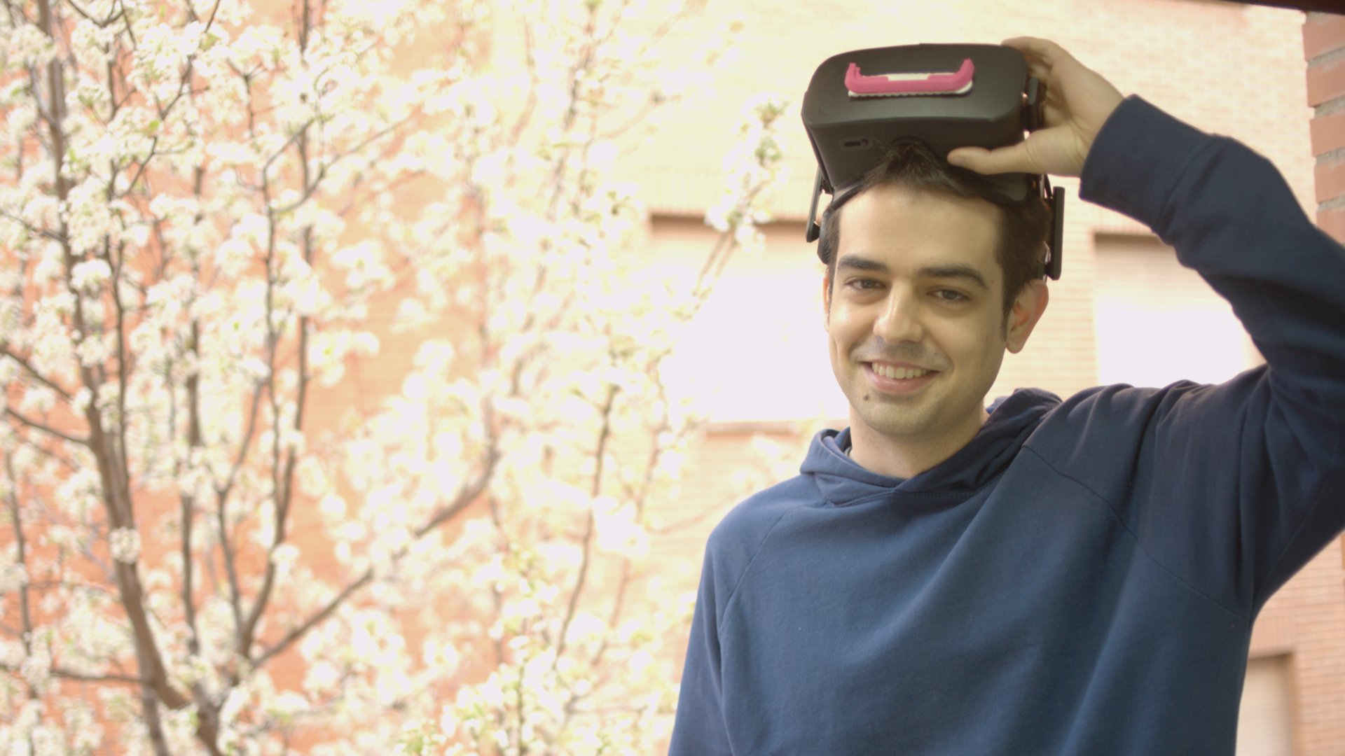 Juanfran smiling at camera with virtual reality glasses